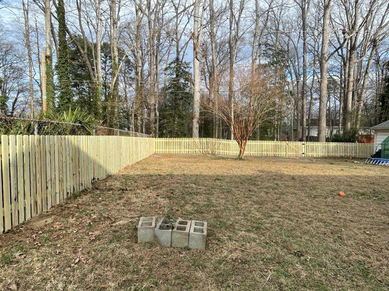 wood picket fence installed by top rail fence