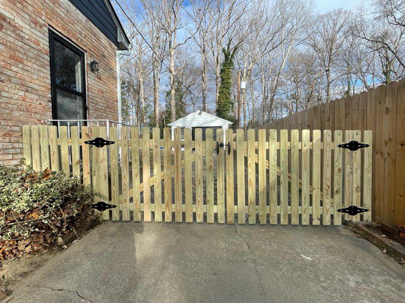 wood picket gate installed by top rail fence