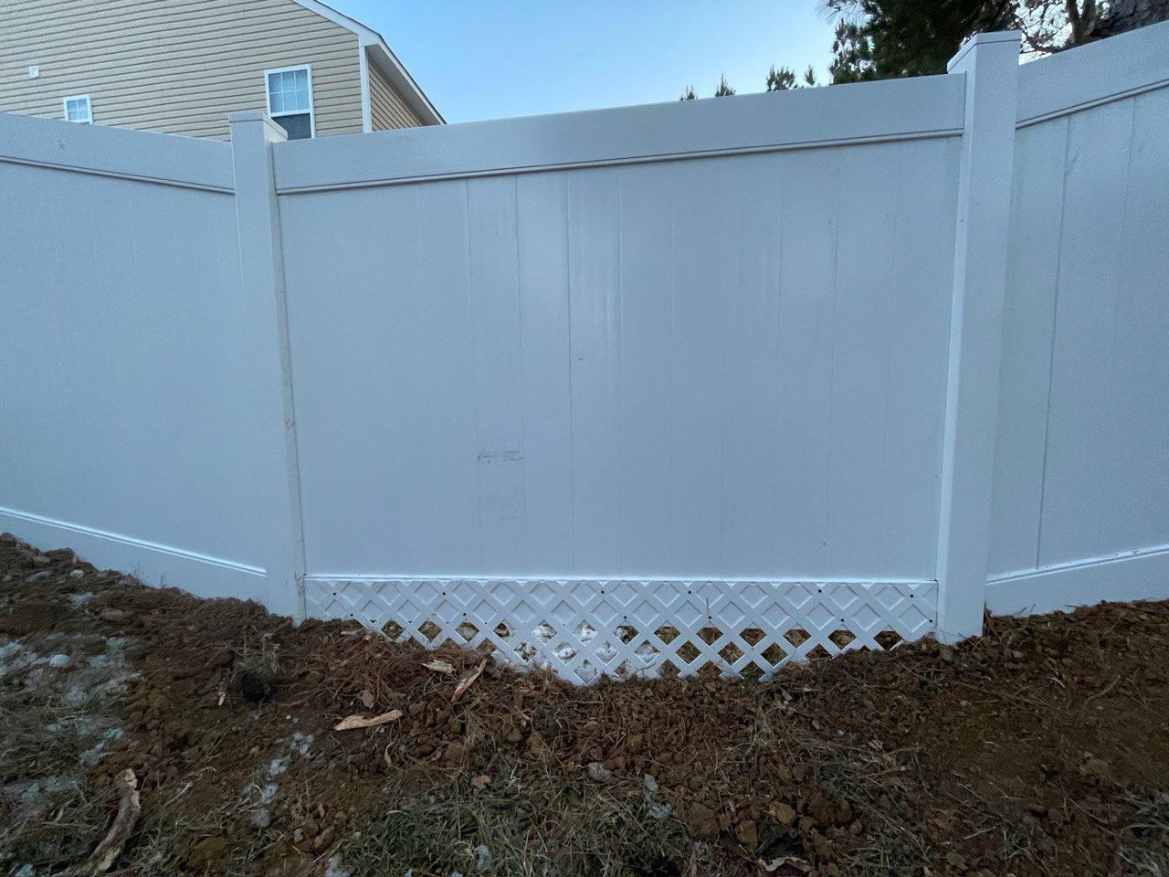 vinyl privacy fence installed by top rail fence