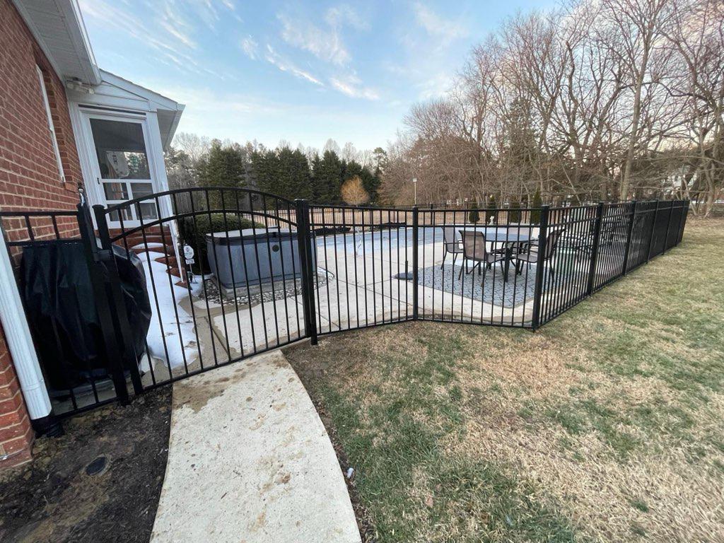  ornamental metal fence installed by top rail fence