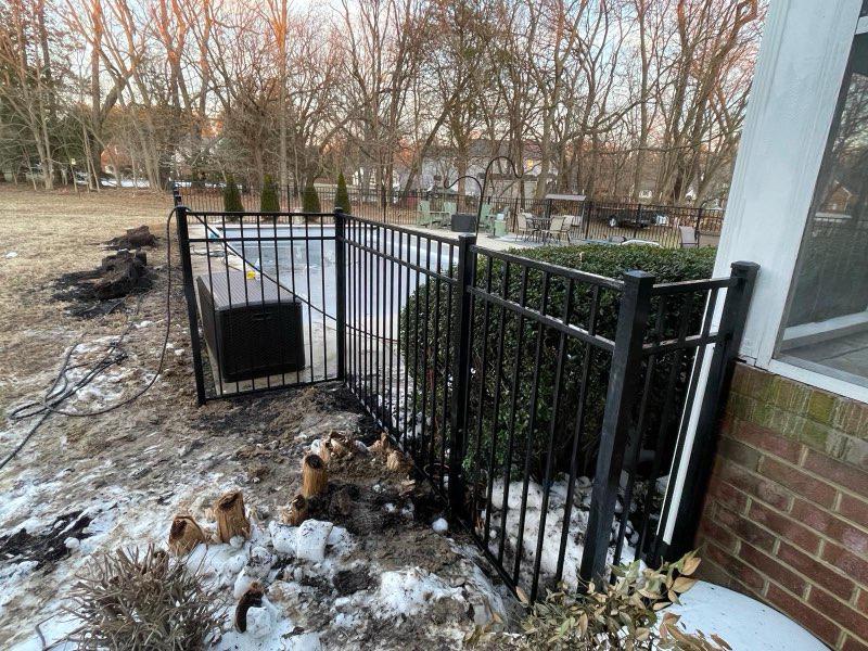  ornamental metal fence installed by top rail fence