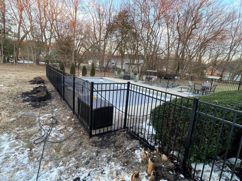  ornamental metal fence installed by top rail fence