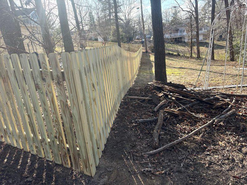 wood picket fence installed by top rail fence