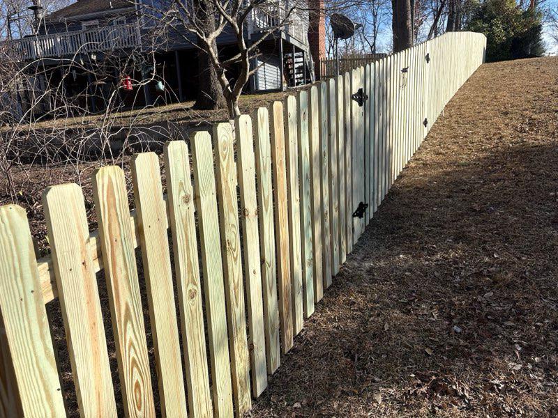 wood picket fence installed by top rail fence