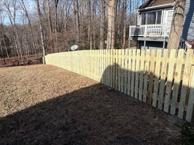wood picket fence installed by top rail fence