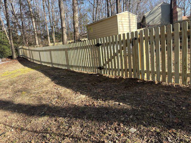 wood picket fence installed by top rail fence