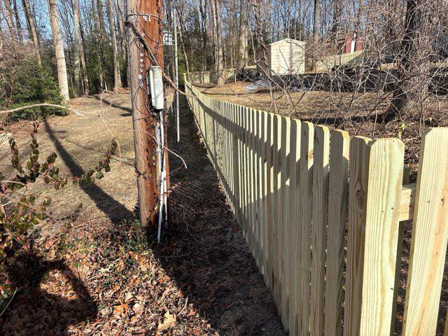 wood picket fence installed by top rail fence