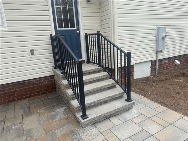 ornamental metal railing installed by top rail fence