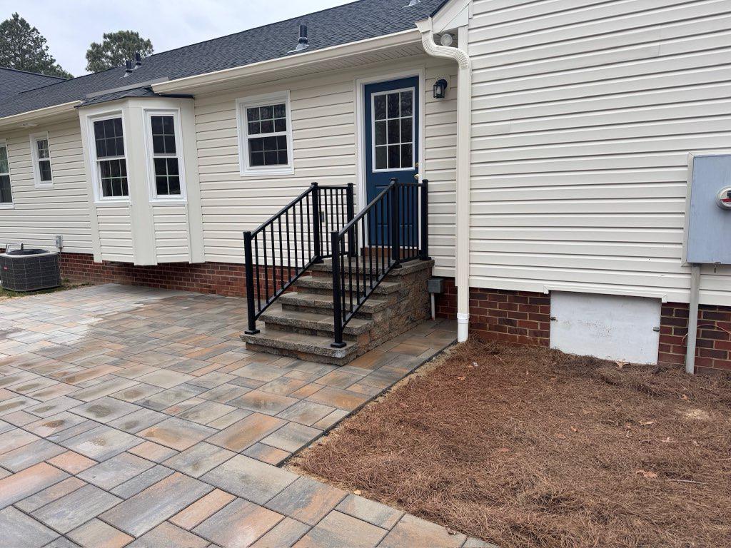 ornamental metal railing installed by top rail fence