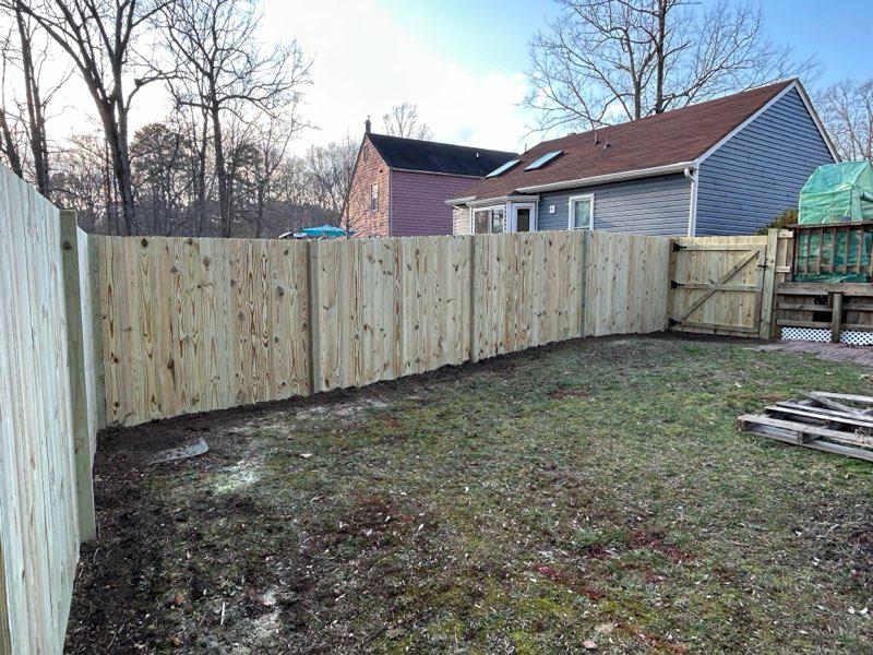 wood fence installed by top rail fence