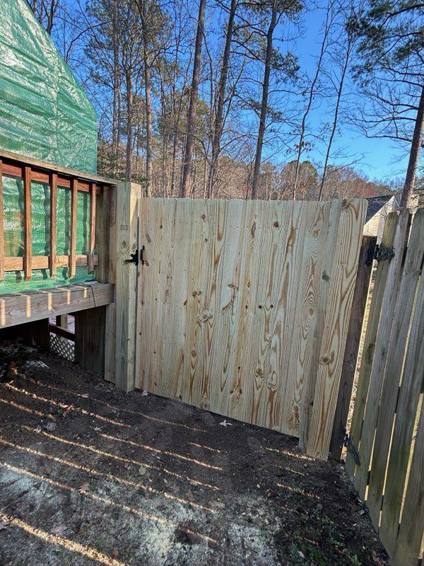 wood privacy fence installed by top rail fence