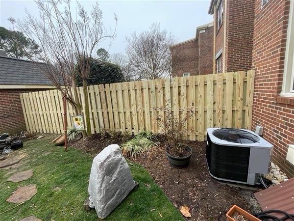 shadowbox wood fence installed by top rail fence