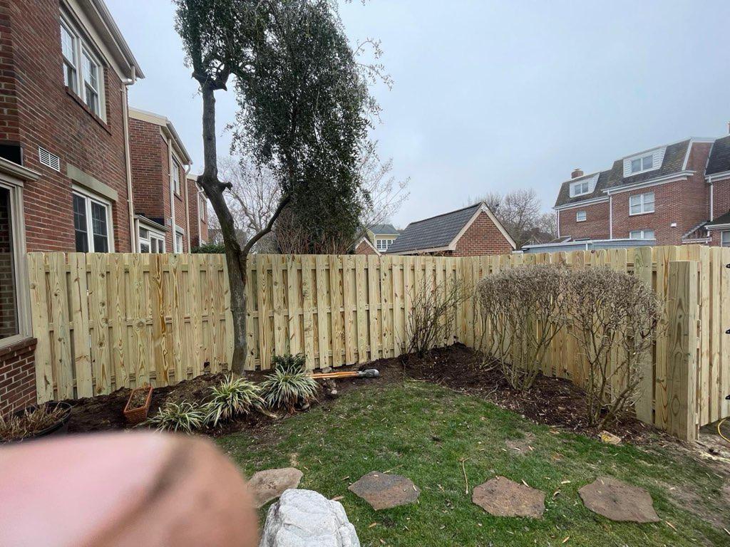 wood shadowbox fence installed by top rail fence