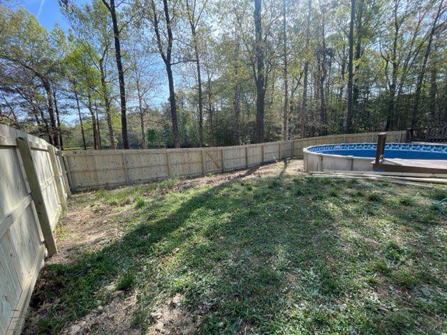 wood fence installed by top rail fence