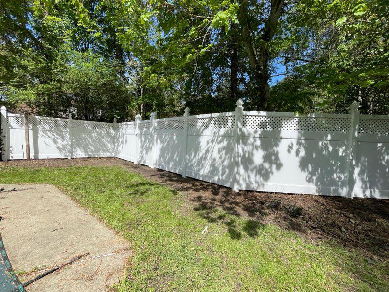vinyl privacy fence installed by top rail fence