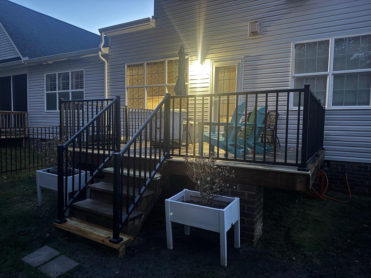 ornamental metal railing installed by top rail fence