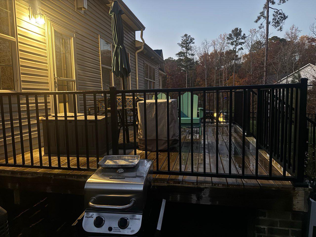 ornamental metal railing installed by top rail fence