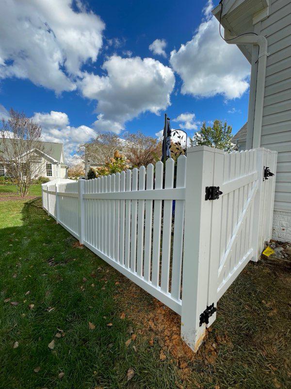 vinyl picket fence installed by top rail fence