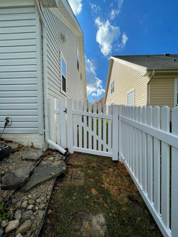 vinyl picket fence installed by top rail fence