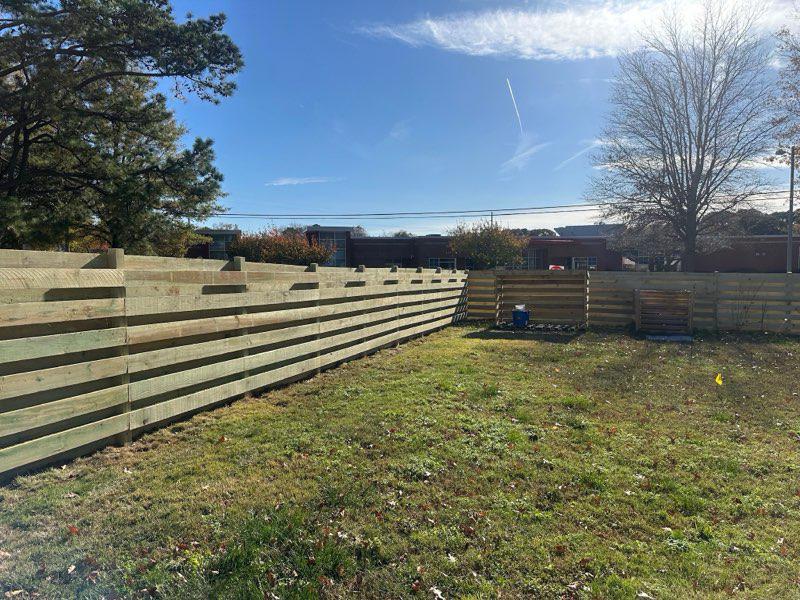 wood horizontal fence installed by top rail fence