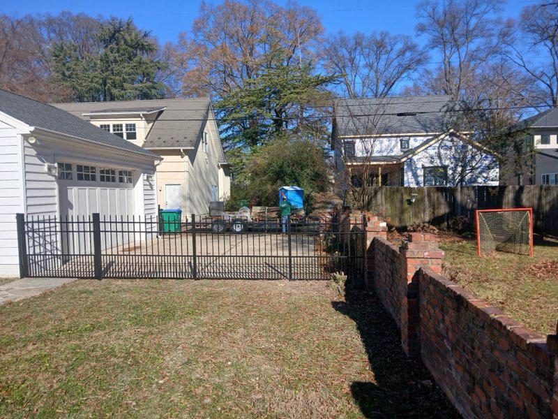 ornamental metal railing installed by top rail fence