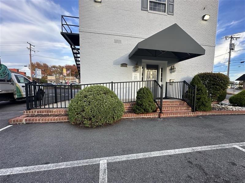 ornamental metal railing installed by top rail fence