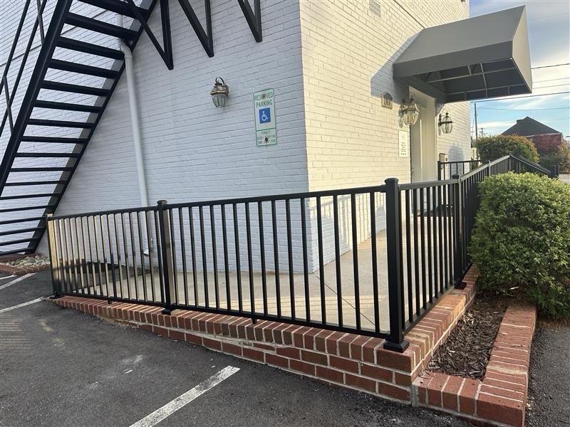 ornamental metal fence installed by top rail fence