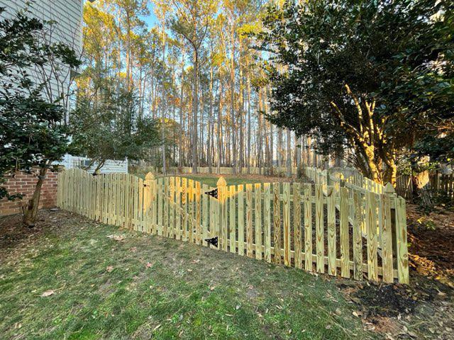 wood picket fence installed by top rail fence