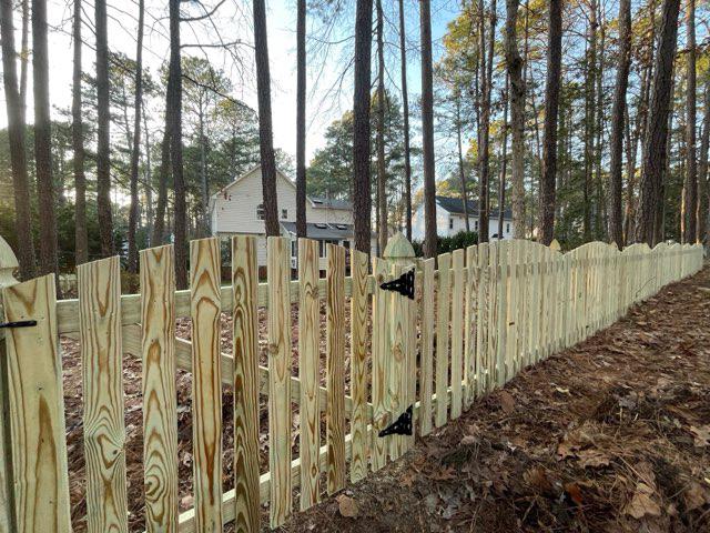 wood picket fence installed by top rail fence