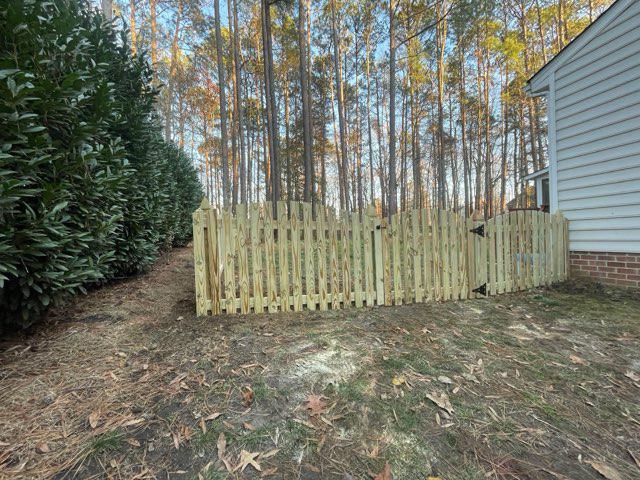 wood picket fence installed by top rail fence