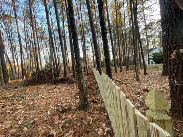 wood picket fence installed by top rail fence