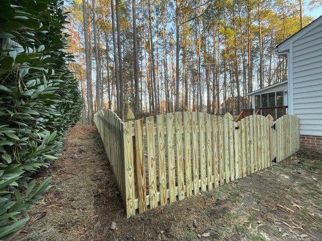 wood picket fence installed by top rail fence