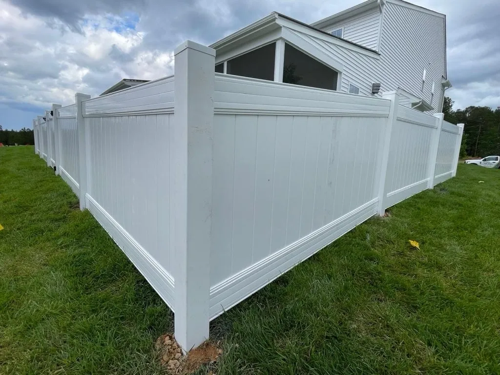 vinyl privacy fence installed by top rail fence