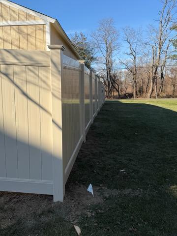 vinyl privacy fence installed by top rail fence