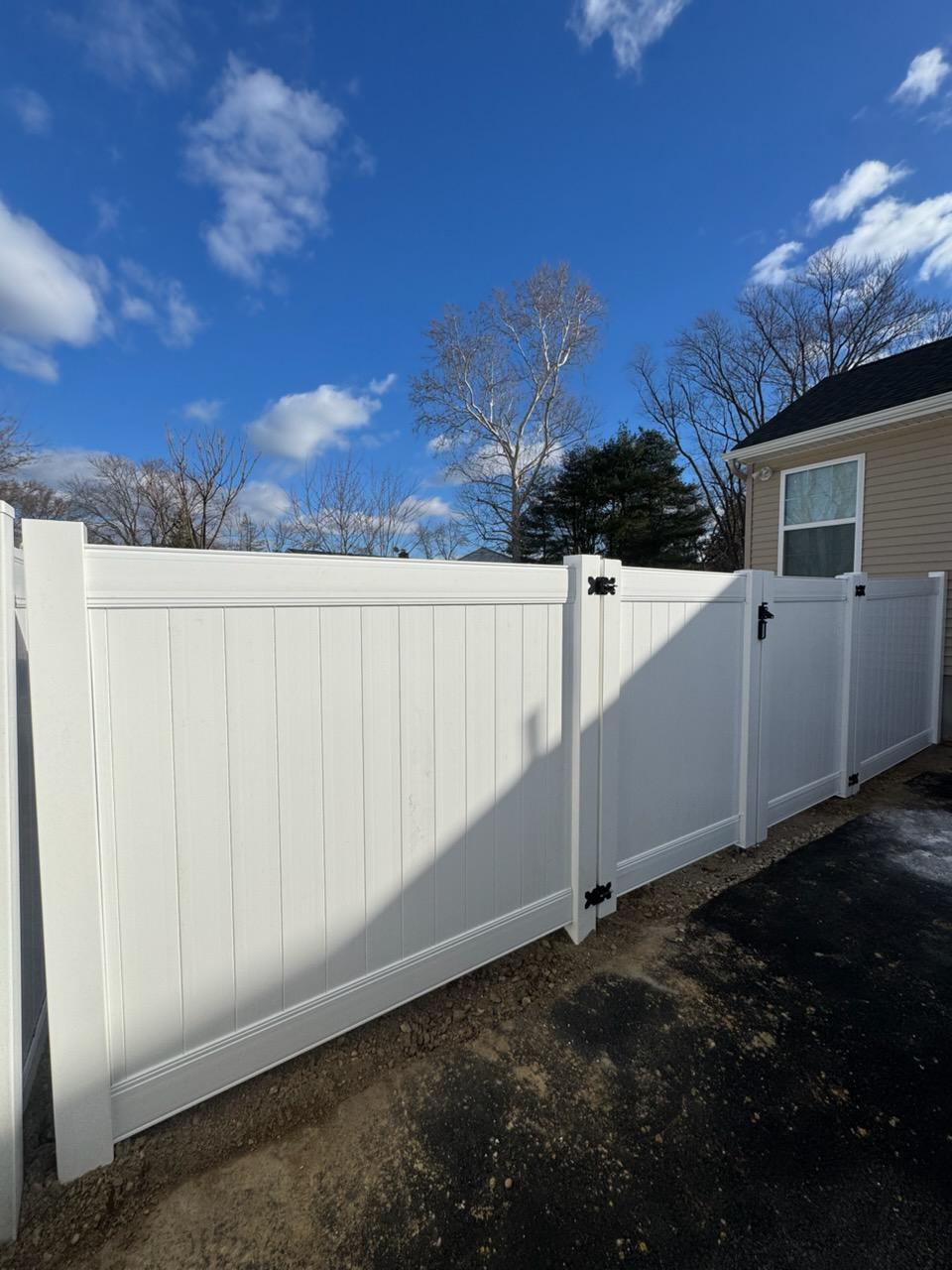 vinyl privacy fence installed by top rail fence