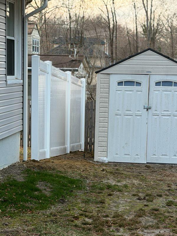 vinyl privacy fence installed by top rail fence