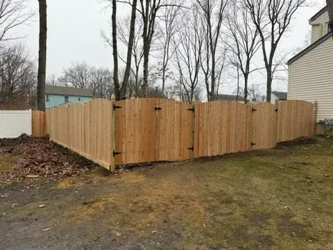wood stockade fence installed by top rail fence