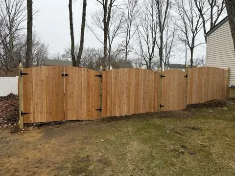 wood stockade fence installed by top rail fence