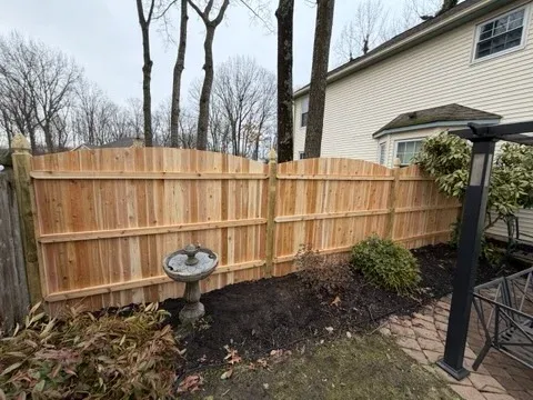 wood stockade fence installed by top rail fence