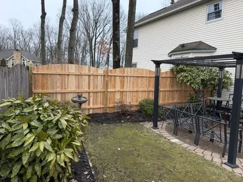 wood stockade fence installed by top rail fence