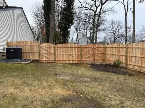 wood stockade fence installed by top rail fence