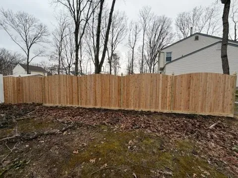 wood stockade fence installed by top rail fence