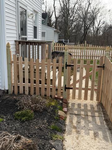 wood picket fence installed by top rail fence