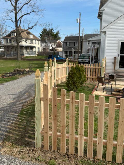 wood picket fence installed by top rail fence