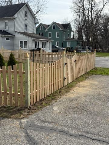 wood picket fence installed by top rail fence