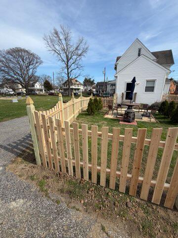 wood picket fence installed by top rail fence
