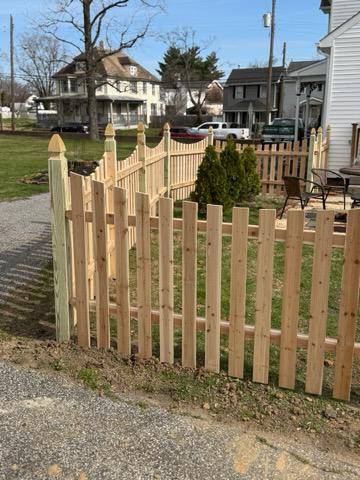 wood picket fence installed by top rail fence