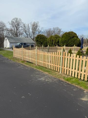 wood picket fence installed by top rail fence