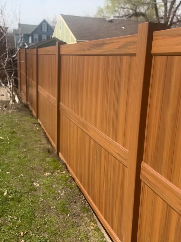 vinyl privacy fence installed by top rail fence