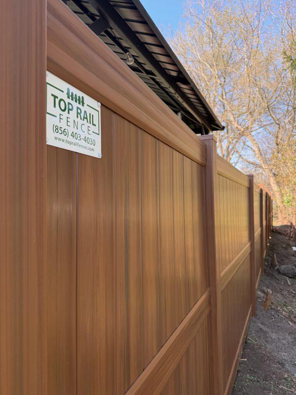 vinyl privacy fence installed by top rail fence